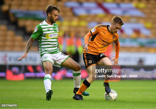 James Bailey of Yeovil Town and Connor Ronan of Wolverhampton Wanderers during the Carabao Cup First Round match between Wolverhampton Wanderers and...