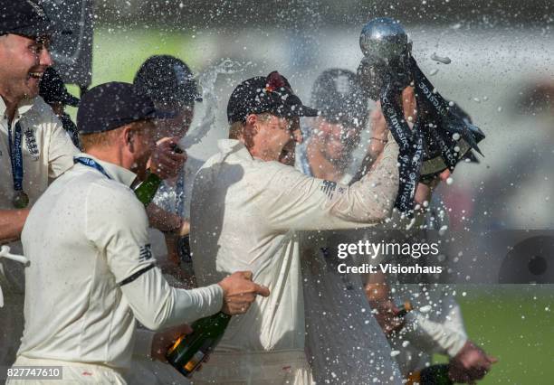 England captain Joe Root gets sprayed by champagne after the fourth day of the fourth test between England and South Africa at Old Trafford on August...