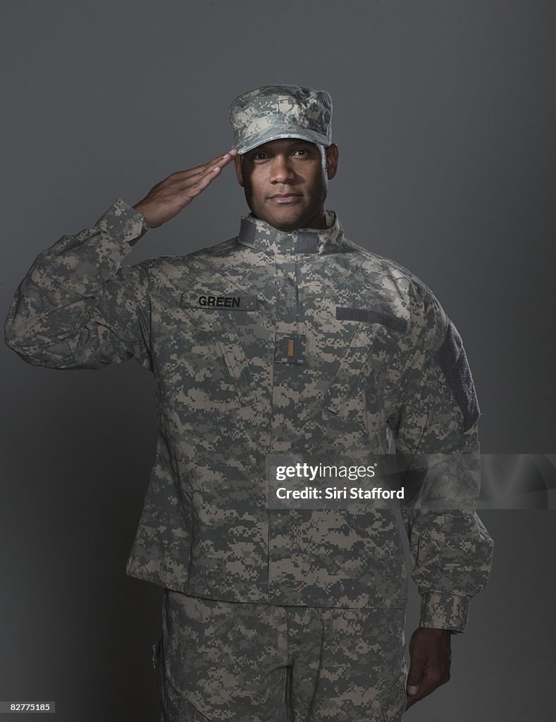 Man in military uniform, saluting