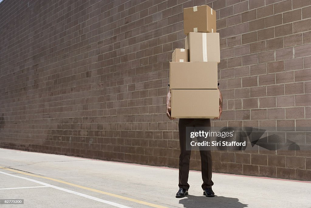 Delivery-person carrying boxes