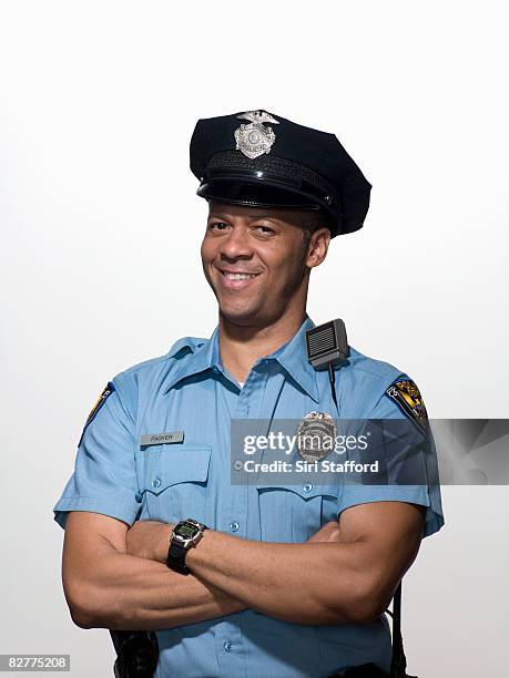 portrait of law enforcement officer, close-up - police hat stock pictures, royalty-free photos & images