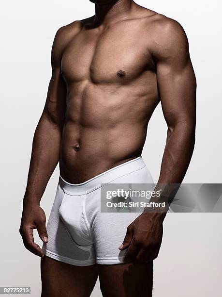 muscular man in boxer-brief underwear - black pants stock pictures, royalty-free photos & images