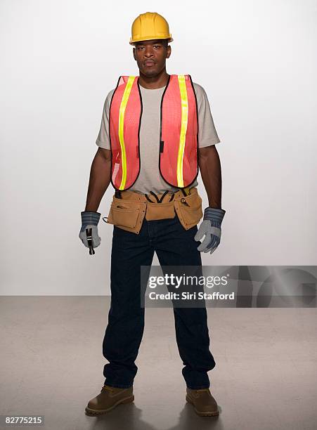 man in construction outfit - black man full body portrait stock pictures, royalty-free photos & images