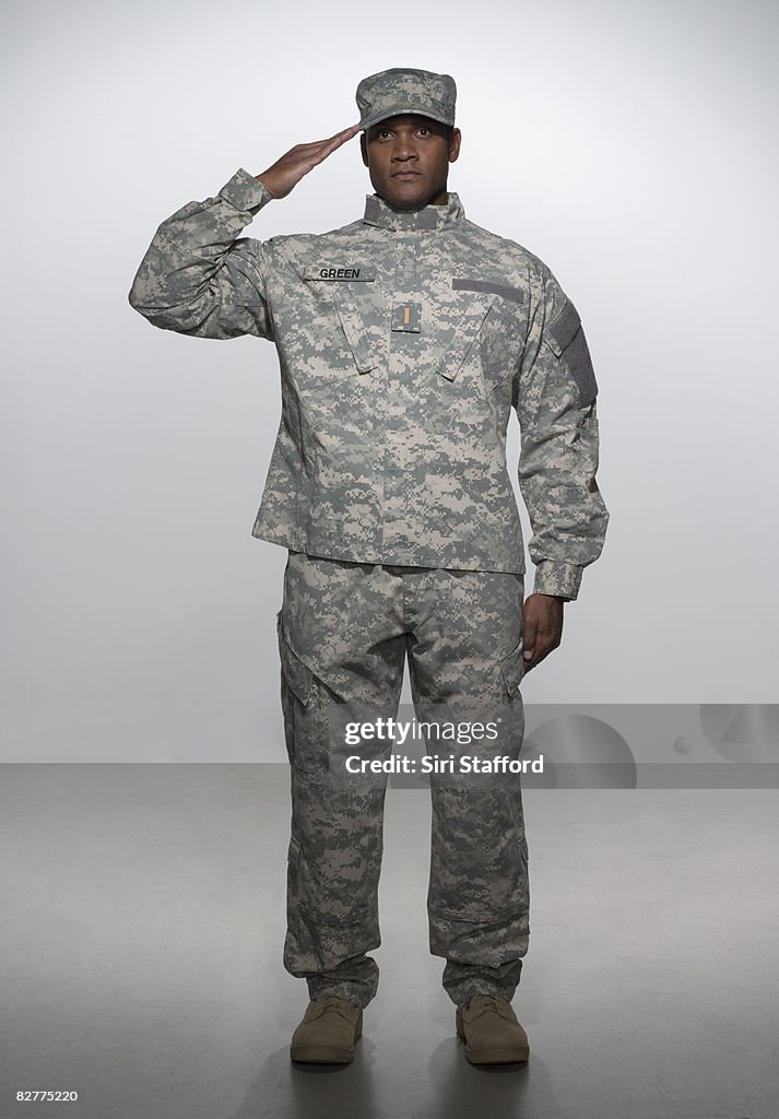 Man in military uniform, saluting