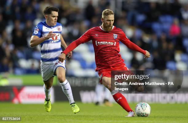 Gillingham's Scott Wagstaff gets a shot on gaol past Reading's Liam Kelly during the Carabao Cup, first round match at the Madejski Stadium, Reading.