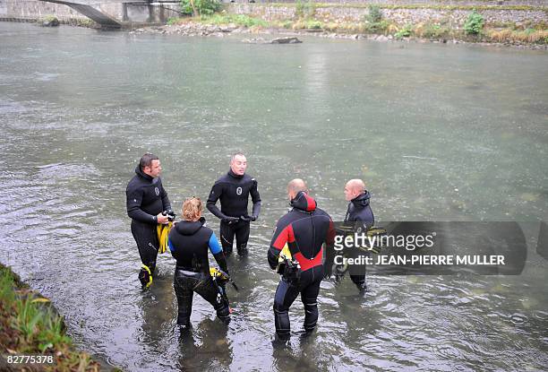 Divers listens to the last instructions during a drill by the Gave river on September 11, 2008 in Lourdes ahead of the visit of Pope Benedict XVI who...