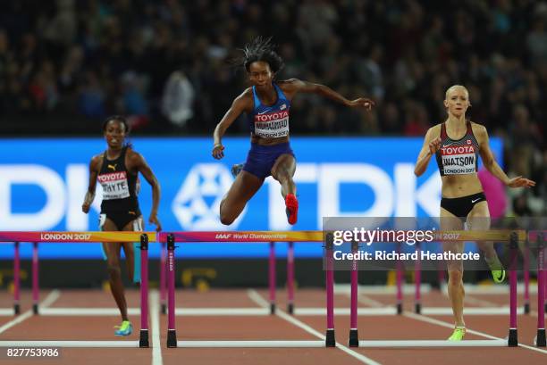 Dalilah Muhammad of the United States and Sage Watson of Canada compete in the Women's 400 metres hurdles semi finals during day five of the 16th...