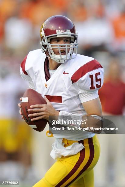 Aaron Corp of the Southern California Trojans rolls out to pass against the Virginia Cavaliers during the game at Scott Stadium on August 30, 2008 in...