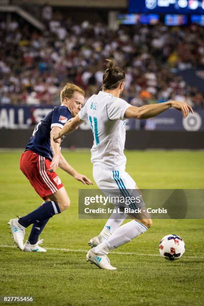 Gareth Bale of Real Madrid tries to keep control from Dax McCarty of the MLS All-Star team during the MLS All-Star match between the MLS All-Stars...