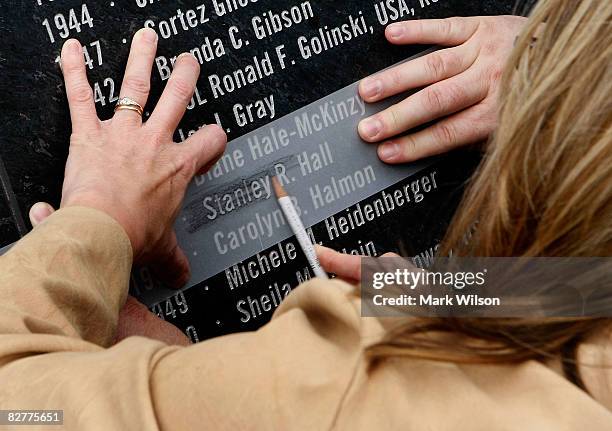 Susan Vanvolkenburgh traces her father's name Stanley R. Hall, who was a passanger on flight 77 following the Pentagon Memorial dedication ceremony...