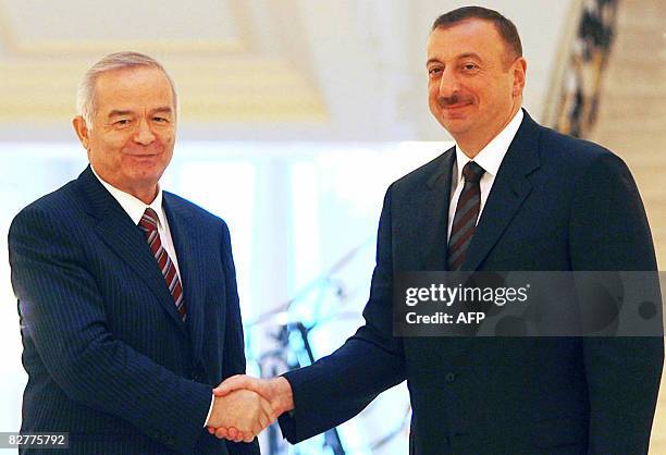 President of Uzbekistan Islam Karimov poses with President of Azerbaijan Ilham Aliyev in Baku on September 11, 2008. The two presidents discussed...