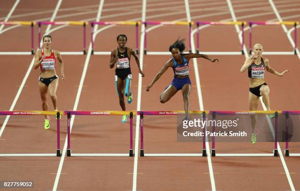 Dalilah Muhammad of the United States and Sage Watson of Canada compete in the Women's 400 metres hurdles semi finals during day five of the 16th...