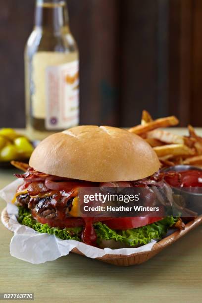 bacon cheese burger with bbq sauce - messy cheeseburger stock pictures, royalty-free photos & images