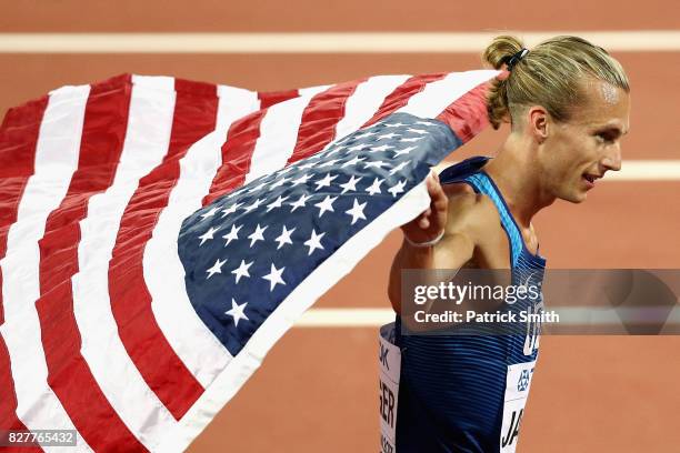 Evan Jager of the United States celebrates with the American flag after winning bronze in the Men's 3000 metres Steeplechase final during day five of...