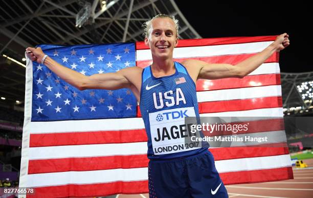 Evan Jager of the United States celebrates with the American flag after winning bronze in the Men's 3000 metres Steeplechase final during day five of...
