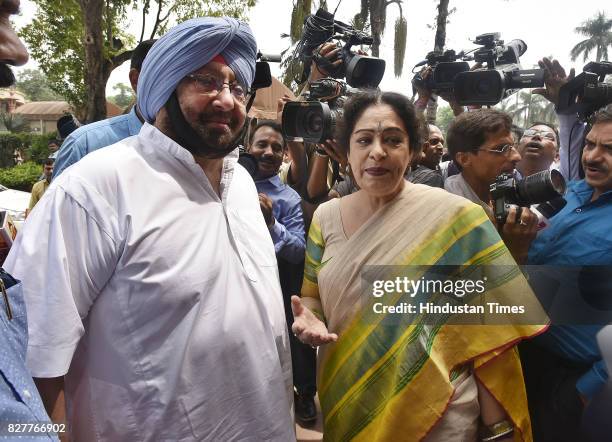 Captain Amarinder Singh, Chief Minister of Punjab, talking to BJP MP from Chandigarh Kirron Kher during the Monsoon Session at Parliament House on...
