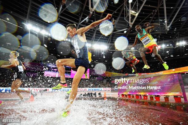 Matthew Hughes of Canada , Yoann Kowal of France and Tesfaye Deriba of Ethiopia take the water jump as they compete in the Men's 3000 metres...