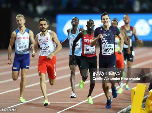 Pierre-Ambroise Bosse of France crosses the finish line to win the Men's 800 metres final ahead of Adam Kszczot of Poland, Kipyegon Bett of Kenya and...