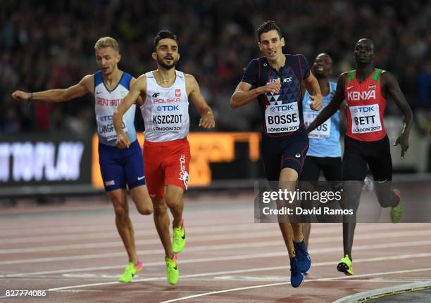 Pierre-Ambroise Bosse of France crosses the finish line to win the Men's 800 metres final ahead of Adam Kszczot of Poland, Kipyegon Bett of Kenya and...