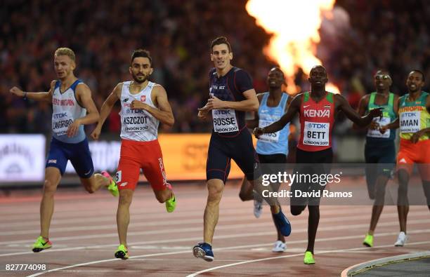 Pierre-Ambroise Bosse of France crosses the finish line to win the Men's 800 metres final ahead of Adam Kszczot of Poland, Kipyegon Bett of Kenya and...