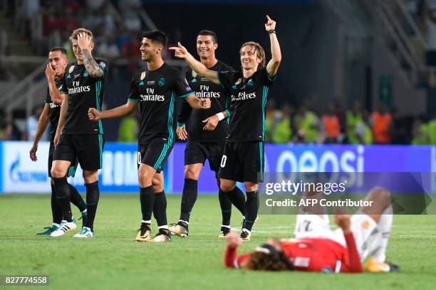 Madrid players celebrate after winning the UEFA Super Cup football match between Real Madrid and Manchester United on August 8 at the Philip II Arena...