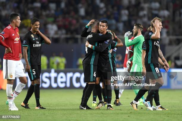 Madrid players celebrate after winning the UEFA Super Cup football match between Real Madrid and Manchester United on August 8 at the Philip II Arena...