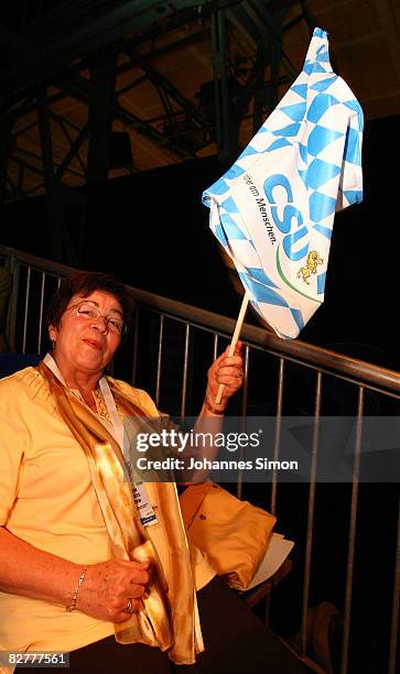 Supporter of the Christian Social Union is brandishing a CSU flag during a CSU party rally at Zenithhalle on September 11, 2008 in Munich, Germany....