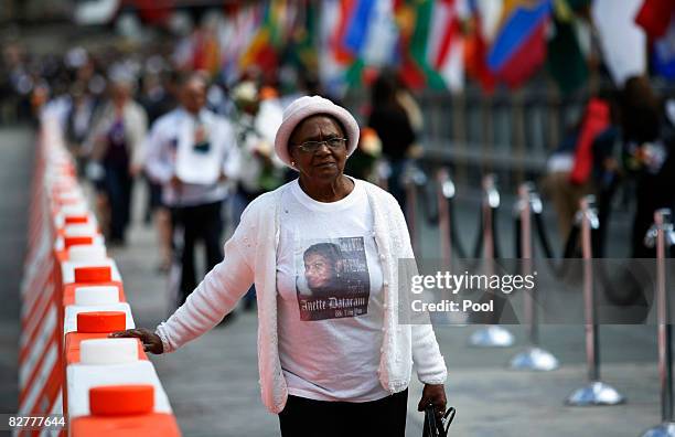 Woman enters Ground Zero to pay her respects during the 7th annual 9/11 memorial ceremony September 11, 2008 in New York City. Family and friends of...