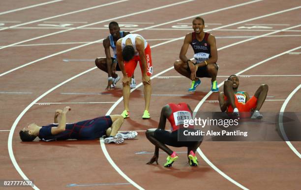 Pierre-Ambroise Bosse of France, gold, and Adam Kszczot of Poland, silver, react after the Men's 800 metres final during day five of the 16th IAAF...