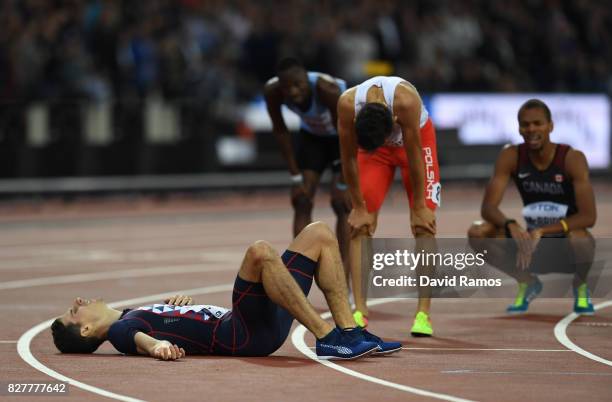 Pierre-Ambroise Bosse of France, gold, and Adam Kszczot of Poland, silver, react after the Men's 800 metres final during day five of the 16th IAAF...