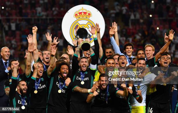 Sergio Ramos of Real Madrid lifts The UEFA Super Cup trophy after the UEFA Super Cup final between Real Madrid and Manchester United at the Philip II...