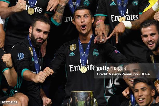 Cristiano Ronaldo of Real Madrid celebrates with UEFA Super Cup trophy after the UEFA Super Cup final between Real Madrid and Manchester United at...