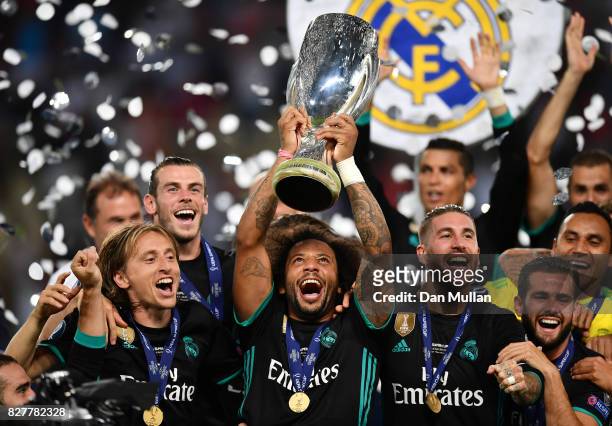 Marcelo of Real Madrid lifts The UEFA Super Cup trophy after the UEFA Super Cup final between Real Madrid and Manchester United at the Philip II...