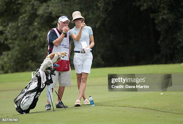 Anna Rawson of Australia talks with her caddie in the 9th fairway during first round play in the Bell Micro LPGA Classic at Magnolia Grove Golf...