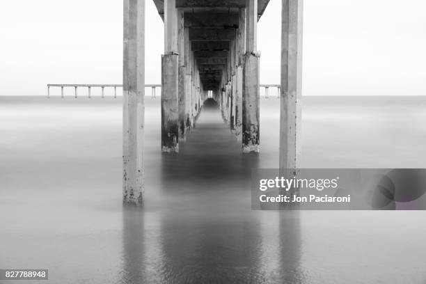 infrared long exposure of ocean beach pier in san diego, ca - asymmetry stock pictures, royalty-free photos & images