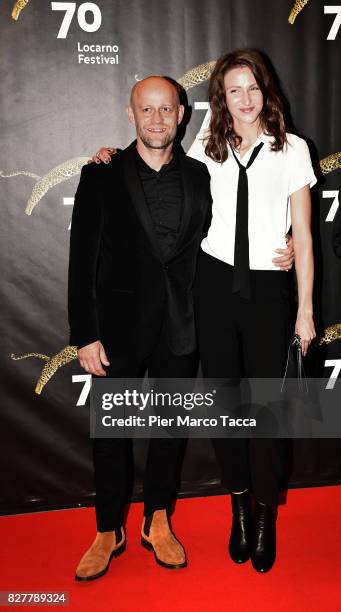 Actor Juergen Vogel and girlfriend Michelle Gornick pose during the 'Iceman' premiere at the 70th Locarno Film Festival on August 8, 2017 in Locarno,...