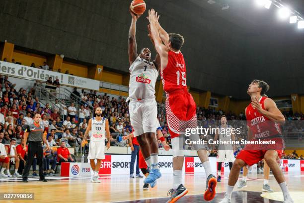 Kevin Seraphin of France is at the basket against Dragan Bender of Croatia during the international friendly game between France and Croatia at...