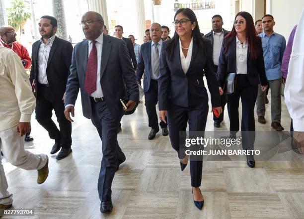 Venezuela's Constituent Assembly's president and vice-president, Delcy Rodriguez and Aristobulo Isturiz respectively, walk next to Venezuelan First...