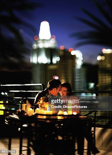 romantic couple on balcony - las vegas city people stock pictures, royalty-free photos & images