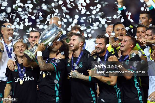 The Real Madrid team celebrate with UEFA Super Cup trophy after the UEFA Super Cup final between Real Madrid and Manchester United at the Philip II...