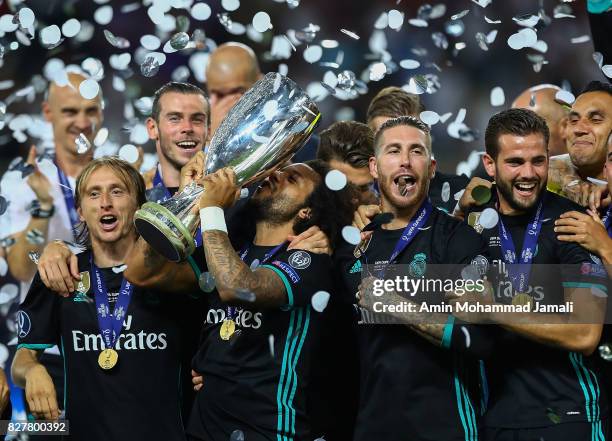 The Real Madrid team celebrate with UEFA Super Cup trophy after the UEFA Super Cup final between Real Madrid and Manchester United at the Philip II...