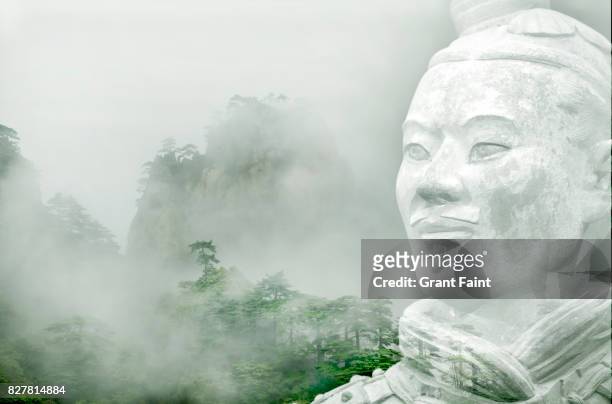 misty mountains and warrior. - lotus flower peak stock pictures, royalty-free photos & images