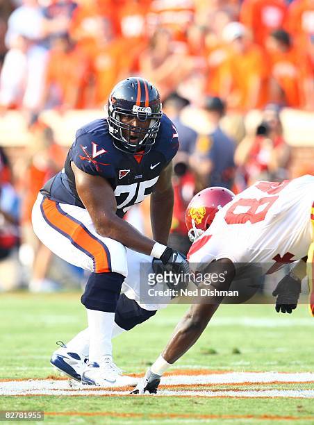 Offensive lineman Eugene Monroe of the University of Virginia Cavaliers blocks against the University of Southern California Trojans on August 30,...
