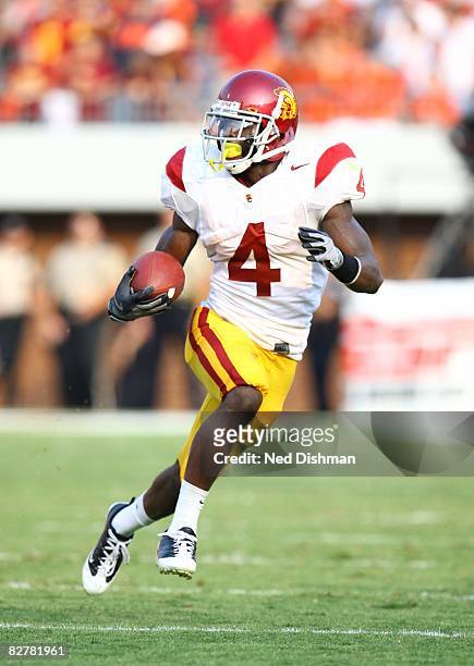Running back Joe McKnight of the University of Southern California Trojans runs with the ball against the University of Virginia Cavaliers on August...