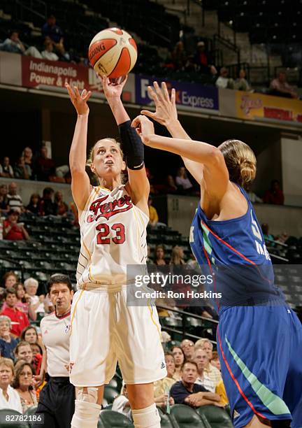 Katie Douglas of the Indiana Fever shoots over Jessica Davenport of the New York Liberty at Conseco Fieldhouse on September 11, 2008 in Indianapolis,...