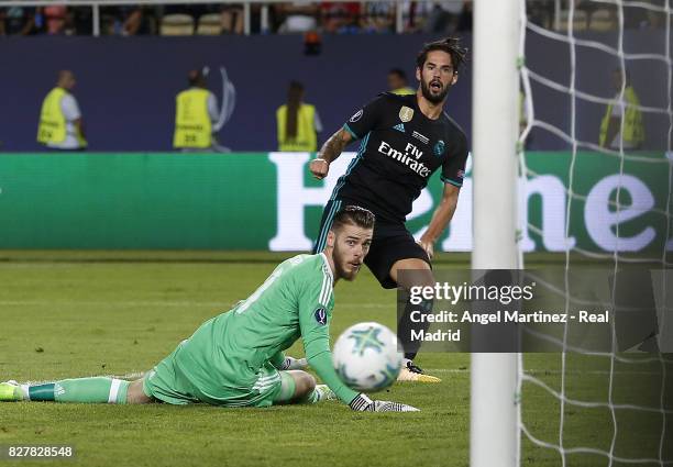 Isco of Real Madrid scores his team's second goal past David de Gea of Manchester United during the UEFA Super Cup match between Real Madrid and...