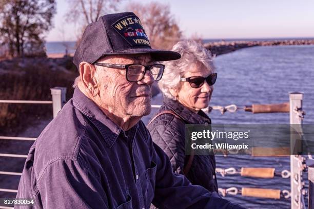 usa wwii military war veteran father and daughter sightseeing - old time combat stock pictures, royalty-free photos & images