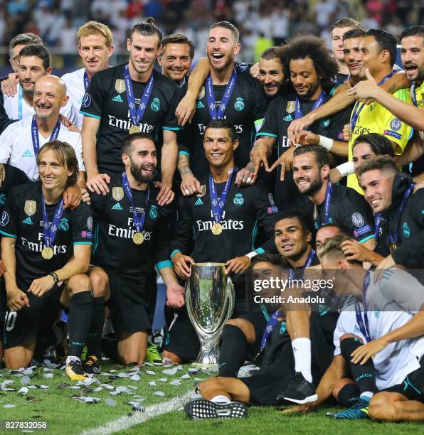 Players and the technical team of Real Madrid celebrate after winning the UEFA Super Cup title in the final match against Manchester United at the...