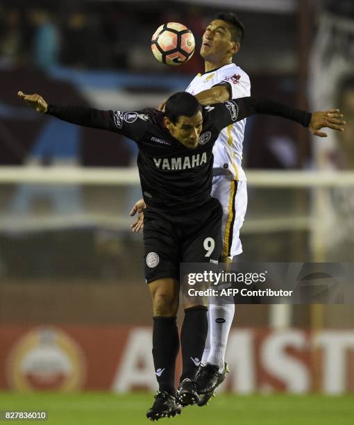 Argentina's Lanus forward Jose Sand vies for the ball with Bolivia's The Strongest defender Luis Eduardo Maldonado during their Copa Libertadores...