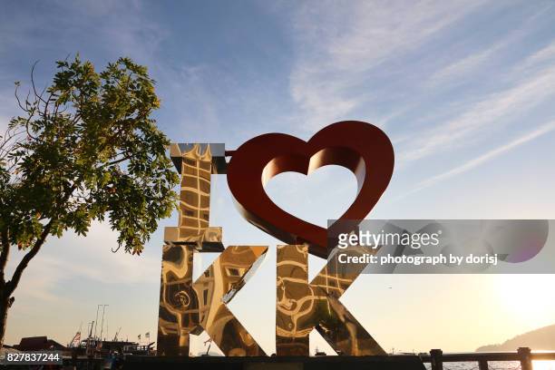 kota kinabalu city's landmark 'i love kk' - silver shark - fotografias e filmes do acervo